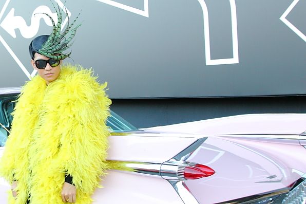 Bryanboy in his big bird outfit outside the Prada Tokyo show venue