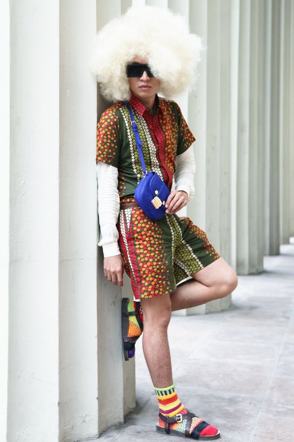 Bryanboy wearing a blond afro wig in Copenhagen.