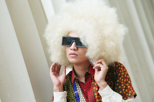 Bryanboy wearing a blond afro wig
