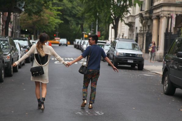 Rumi Neely and Bryanboy holding hands.