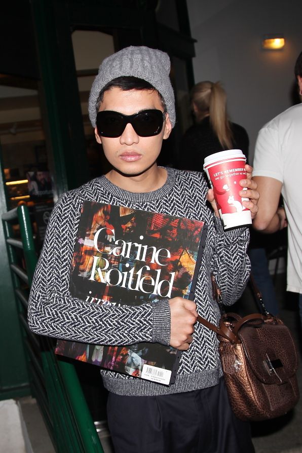 Bryanboy holding Carine Roitfeld's book, Irreverent