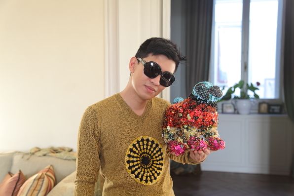 Bryanboy holding Francois pug dog by Mary Katrantzou