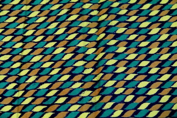 Printed Indian cotton fabric in green, orange and yellow