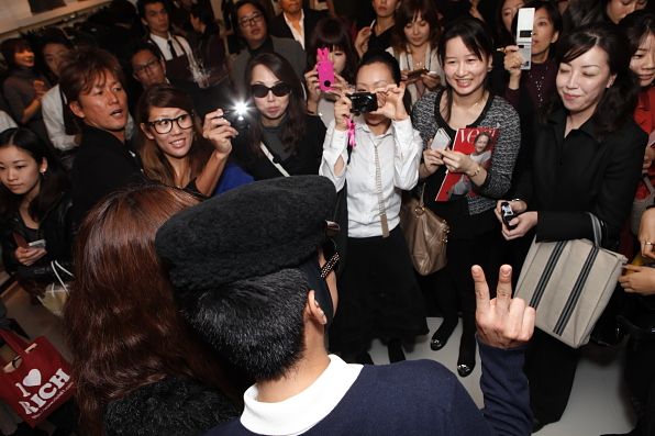 Bryanboy being photographed by his Japanese fans at the Michael Store boutique in Tokyo