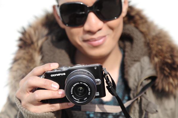 Bryanboy carrying an Olympus Pen E-PL3 camera