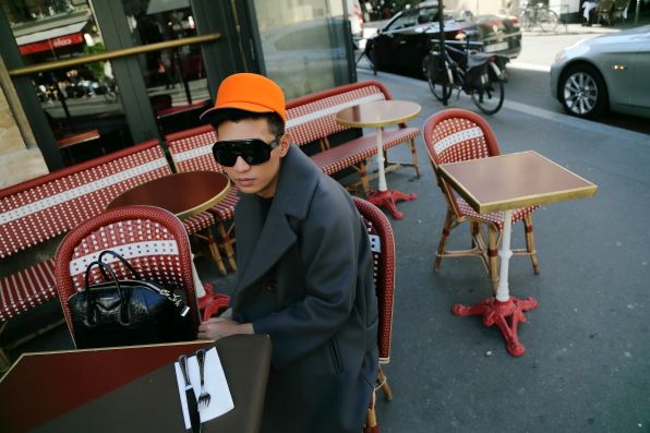 Bryanboy wearing an orange Kenzo hat