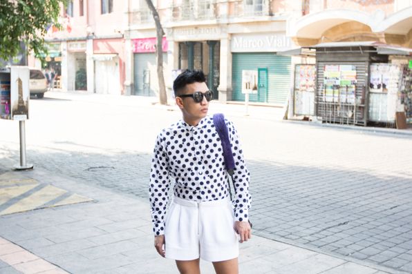 Bryanboy in Mexico City wearing Bryanboy x Adrienne Landau mink fur camera straps