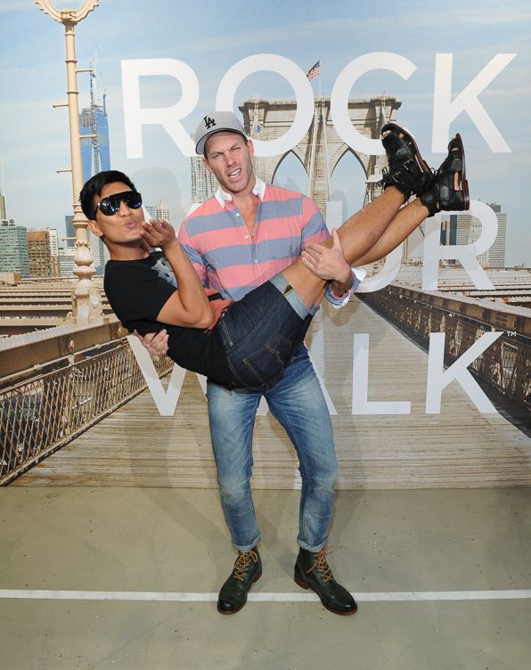 Fashion blogger Bryanboy gets carried by America's Next Top Model Stylist Johnny Wujek at the American Eagle launch of Rock Your Walk project