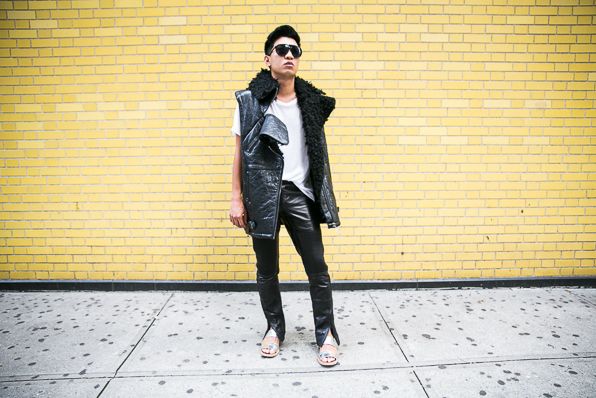 Bryanboy wearing a faux shearling vest, white shirt and leather pants from H&M's Paris Runway collection