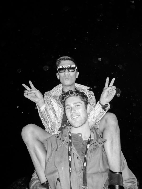 Bryanboy sitting on top of Queenie at Rihanna concert