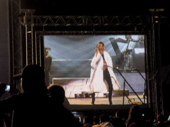 Rihanna wearing a Miu Miu coat on stage at 2013 Mawazine Maroc Rabat Morocco