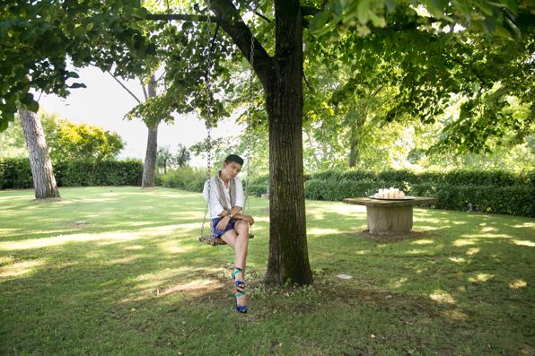 Bryanboy on a leopard swing at Roberto Cavalli's house
