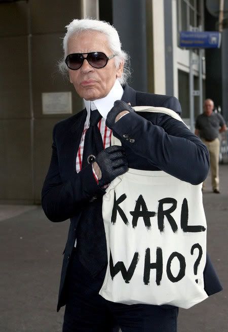 Karl Lagerfeld in Nice Airport carrying a Karl Who? bag
