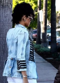 Rihanna wears Balmain Spring 2009 denim military jacket.